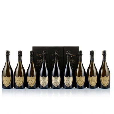 a group of six bottles of champagne sitting next to each other