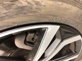 the tire of a car with a flat tire on it ' s rim