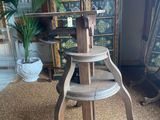 an image of a wooden table with a metal stand on top of it