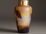 a vase that has a picture of a bird on it