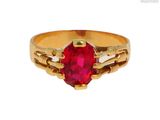une image représentant une bague en or sertie d'un rubis