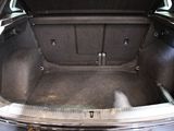 a trunk of a car that is empty with the door open