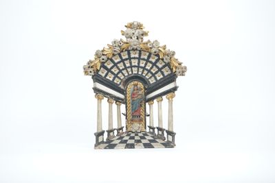 a statue of a clock on a pedestal on a white background