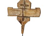 an image of a wooden sculpture of a cross on a stand