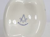 a white porcelain bowl with a blue design on it