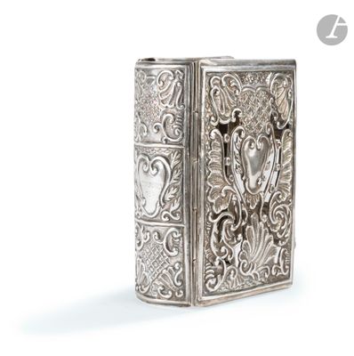 an image of a silver cigarette case with a design on it