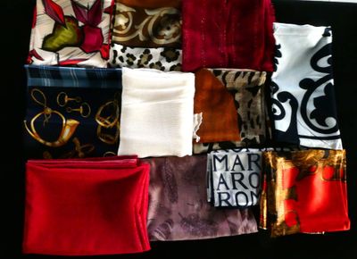 many different types of cloths laid out on a table