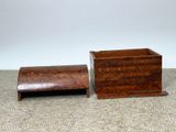 a small wooden box and a smaller wooden box on the floor