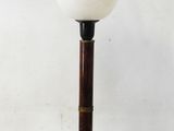 a lamp that is sitting on top of a wooden table