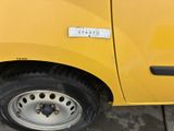 a yellow truck that has a sticker on the side of it