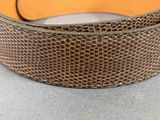 an image of a close up of a leather belt on a table