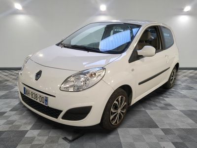 a picture of a small white car parked in a garage