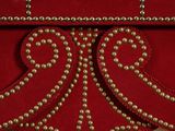 an image of a close up of a red table with a marble top