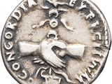 a close up of a silver coin with a bird on it