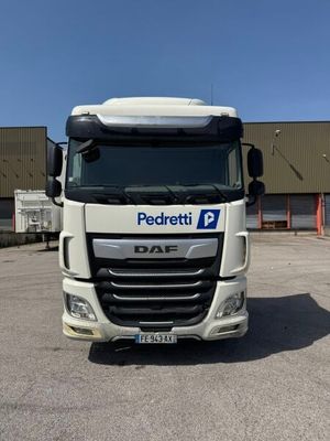 a picture of a white truck parked in front of a building