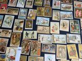 a lot of old postcards on the table