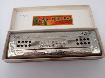 a close up of a harmonica in a box on a table
