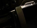 a close up of a car dashboard with a remote control