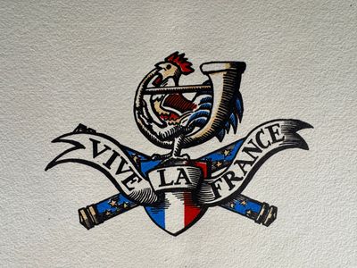 a picture of a logo on the wall of a restaurant