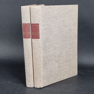 a book with a red cover sitting on top of a table