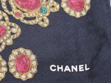 a black bag with a bunch of jewels on it