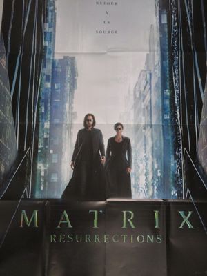 L'affiche du film « Matrix » est accrochée au mur.