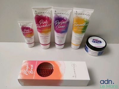 bath and body care products displayed on a table with a box