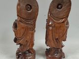 pair of chinese carved wood figures of a man and a woman