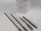 four pieces of drill bits are in a package on a white surface