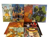 quatre livres dans une boîte sur laquelle figurent des photos de personnes