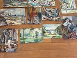 de nombreux tableaux posés par terre dans cette pièce