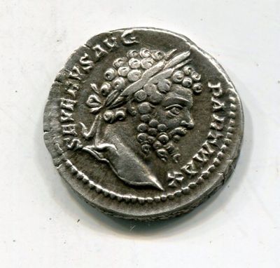 a silver coin with an image of a woman on it