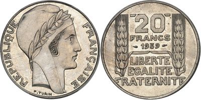 a close up of a coin with a woman ' s head on it