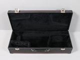 a black suitcase with a black interior sitting on a white surface
