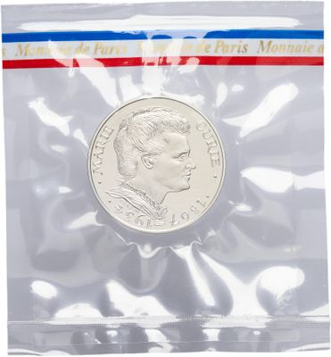 the coin is in a clear plastic bag with a red, white, and blue stripe