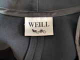 a label on the back of a jacket that says well