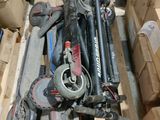 a pile of assorted items sitting on a pallet in a warehouse