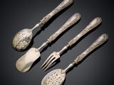 four pieces of silverware including a fork, spoon, and spoon rest