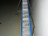 a picture of a conveyor belt in a warehouse
