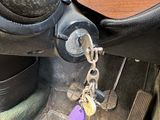 a keychain that is attached to an old sewing machine