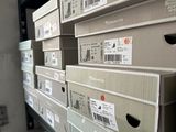 a lot of boxes that are stacked up on a shelf