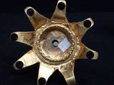 an image of a gold star shaped object on a black surface