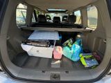 a trunk of a car filled with boxes of food