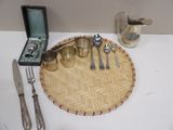 a tray with silverware and silverware sitting on a table