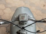 a close up view of a motorcycle handlebar with a speedometer on it