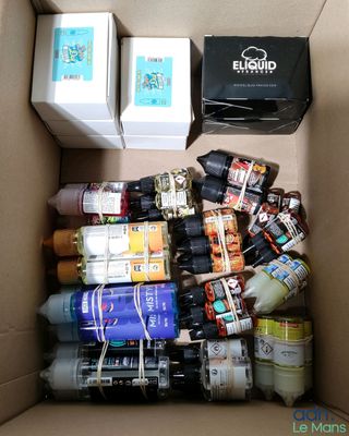 a cardboard box filled with assorted items in it