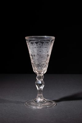 crystal goblet on a black table with a black background