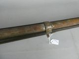 a long metal pipe with a tag attached to it