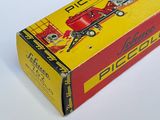 a red and yellow box with a red tractor on it
