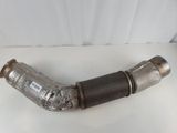 a close up of a motorcycle exhaust pipe on a white surface